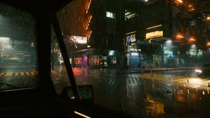 Night City on a rainy night, seen through a car window